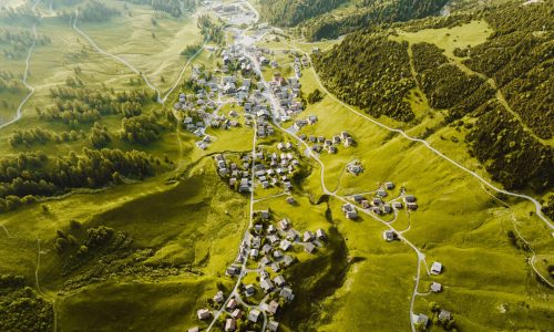 Spectacular aerial view of Malbun village nestled in the lush green mountains of Liechtenstein.