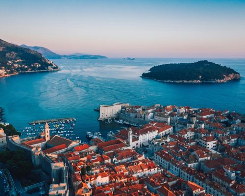 Breathtaking sunset over Dubrovnik's historic cityscape and Adriatic coast.